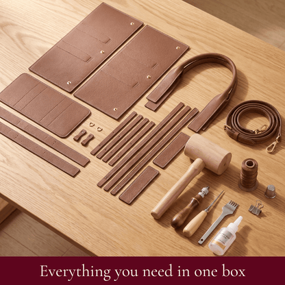 Daphne DIY tote kit contents in brown: pre-cut leather pieces, rolled handles, hardware and tools