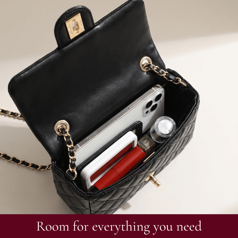 Interior of the Madeline quilted leather shoulder bag holding a phone, wallet and essentials