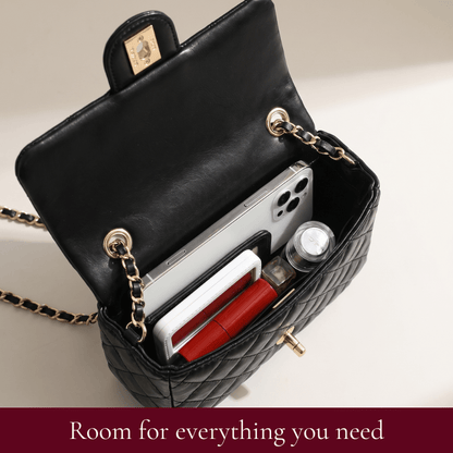Interior of the Madeline quilted leather shoulder bag holding a phone, wallet and essentials