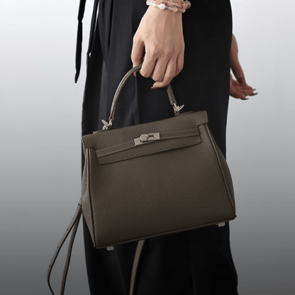 Kit Atelier DIY leather bag kits – finished Grace satchel in grey carried by its top handle