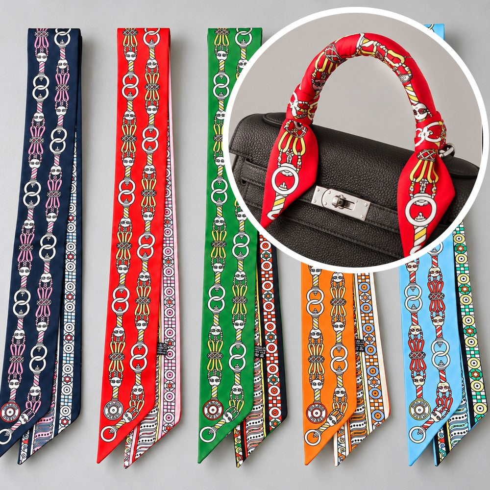 Twilly bag scarf in navy, red, green, orange and sky blue, shown tied on a bag handle