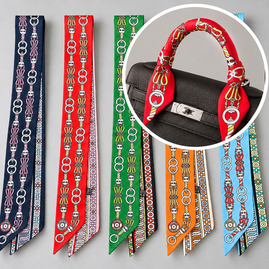 Twilly bag scarf in navy, red, green, orange and sky blue, shown tied on a bag handle