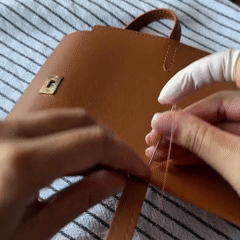 Hand-stitching a Valentina DIY leather wallet clutch kit